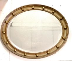 Oval gilt framed bevelled mirror 60cm x 50cm. in good used condition