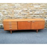 Mid 20th century teak sideboard with original The Design Centre London label. 215 cms in length,