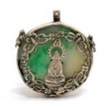 Tibetan jade devotional amulet with white metal decoration - 5cm diameter