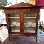Flame mahogany 2 door glazed display cabinet with upstand to the back. 143 cms in width, 44 cms in