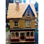 Vintage dolls house on 3 floors containing numerous miniature dolls house items inc bathroom