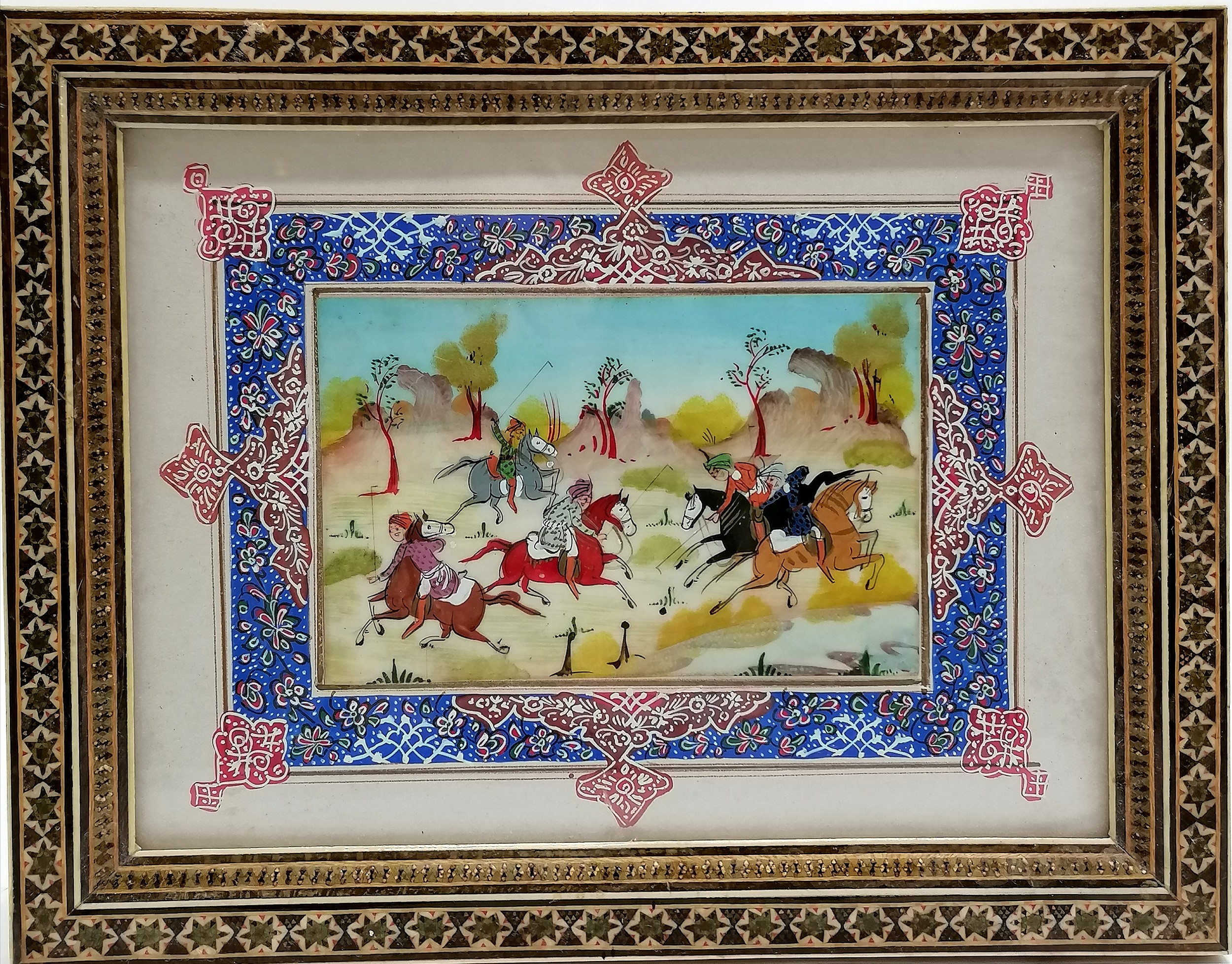 Indian framed original watercolour painting of men on horseback with an easel stand back. 27cm x