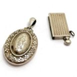 Antique silver locket with embossed detail to front (dents to reverse) t/w 925 silver marked
