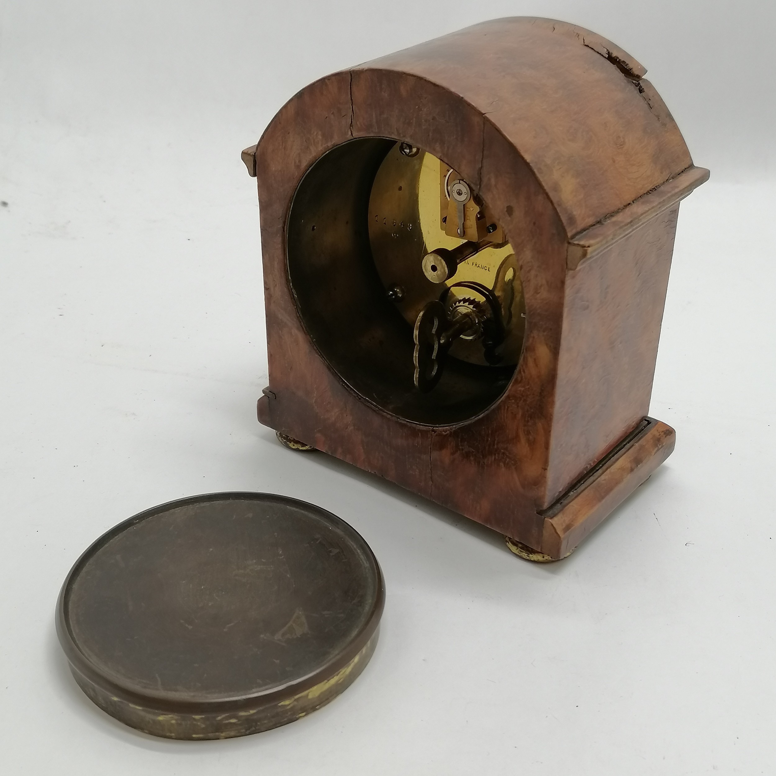 Walnut veneered mantle clock with porcelain dial with key with a French movement - 15cm high and has - Image 2 of 2