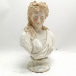 Ceramic bust of a woman with a pink hairband on a painted marbled base 28cm high. in good used
