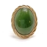 Indistinctly marked gold ring set with a green cabochon stone - size K½ & 4.4g total weight