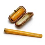 2 x amber cheroot holders (1 in a case) - longest (10cm) has an unmarked gold mount ~ total weight