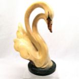 Art Deco ceramic sculpture of a pair of entwinned swans on a simulated granite base 29cms high. In