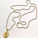 Long silver gilt 120cm chain with yellow metal locket - total weight 28g