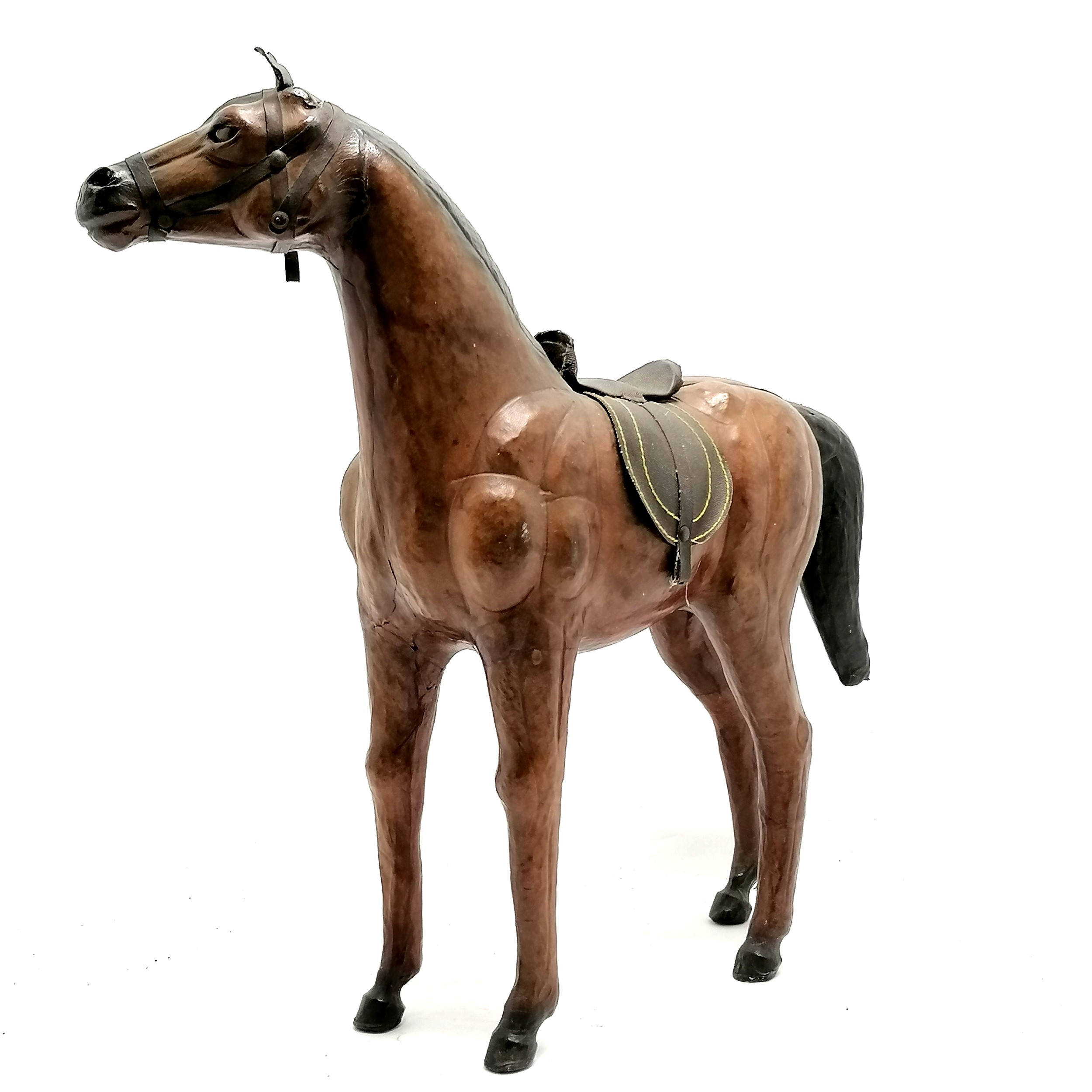 Vintage leather horse with saddle and glass eyes. 49cm high x 48 long in overall good used