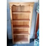 Small pine shelf unit. 130cm x 60cm x 23cm. In overall good used condition.