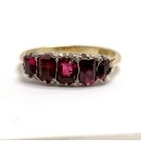 18ct marked gold ruby 5 stone set ring - size Q & 3.3g total weight ~ 3 stones are a/f