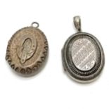 2 x antique unmarked silver lockets both with engraved decoration - longest 4.5cm drop & 30g total