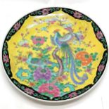 Oriental yellow grounded charger with bird decoration and marked to reverse, 46cm diameter with no