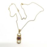 9ct hallmarked gold garnet + white stone pendant (2.5cm) on a 9ct marked gold 44cm chain - total