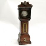 Antique oak pocket watch stand as a grandfather clock with brass decertations and a Secton pocket