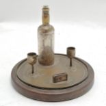 Novelty desk stand as a drinks tray 12cm high x 14.5cm diameter - Bottle wobbles and losses to the