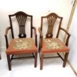 A pair of Hepplewhite style mahogany framed carver chairs, with needlepoint upholstered seats 103