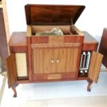 1950s mahogany radiogram with a Garrard autoslim 4 speed record player and a radio and storage for