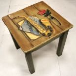 Small painted side table with musical instrument painted to the top.