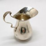 Silver baluster cream jug with acanthus detail to handle - 8.5cm high & 49g ~ has dents