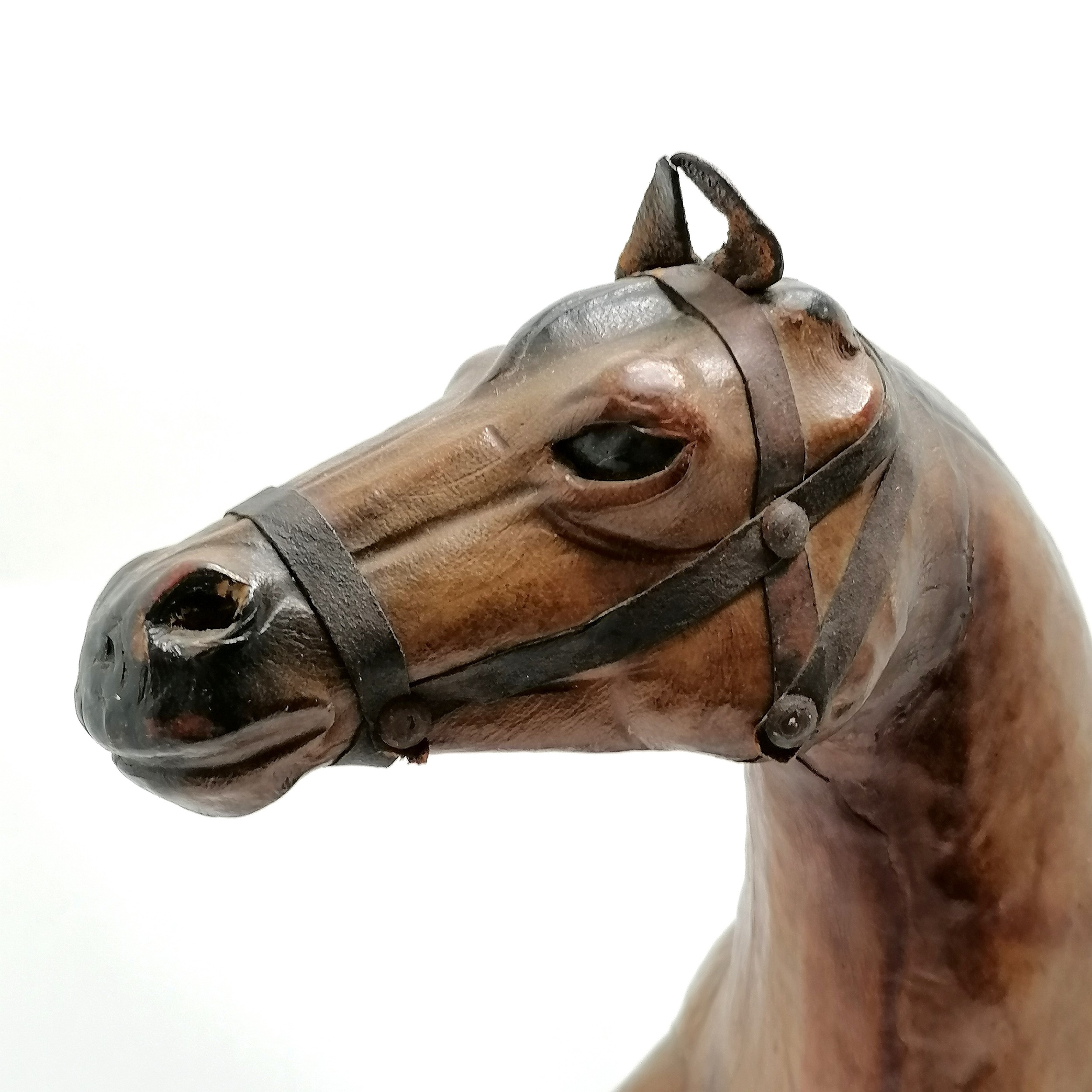 Vintage leather horse with saddle and glass eyes. 49cm high x 48 long in overall good used - Image 2 of 4