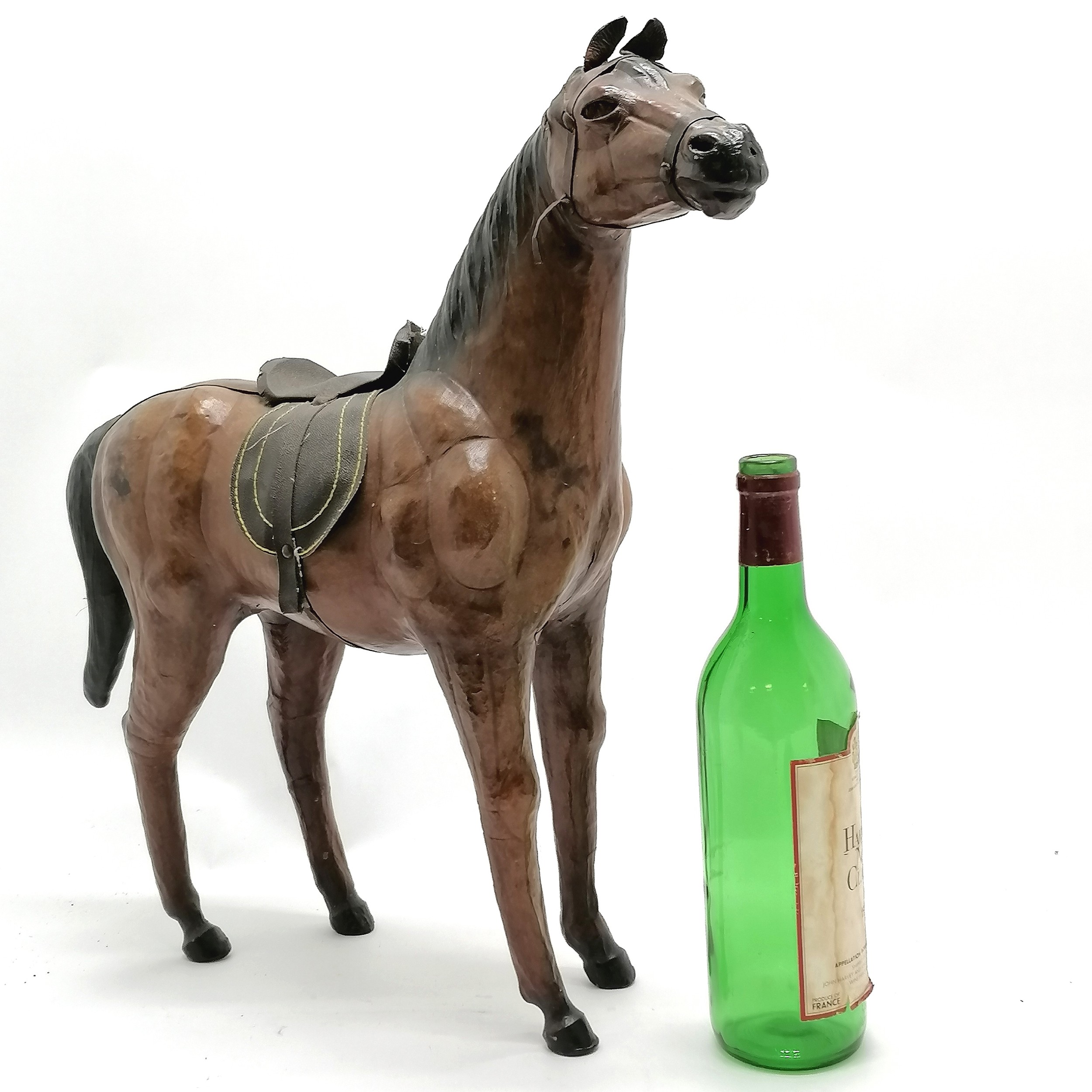 Vintage leather horse with saddle and glass eyes. 49cm high x 48 long in overall good used - Image 3 of 4