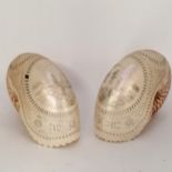 Pair of antique hand carved & scrimshaw nautilus shells depicting an Oceanic man and a woman
