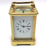 Antique brass carriage clock with bell strike mechanism and key - total height (inc handle) 18cm