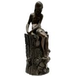 A Bronzed resin figure of a reclining nude on rocky base 15.5 cm high 5 cm diameter by Giovanni