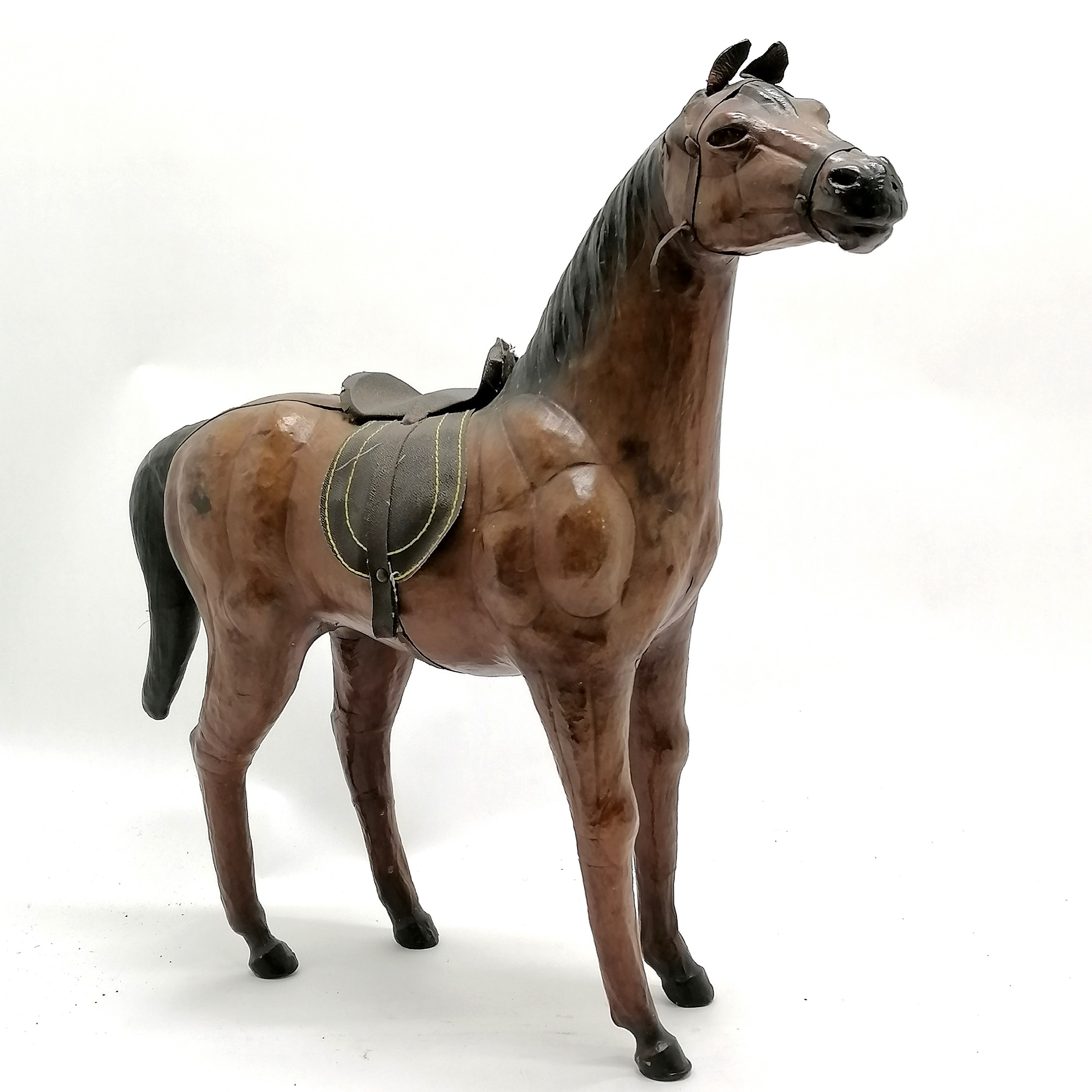 Vintage leather horse with saddle and glass eyes. 49cm high x 48 long in overall good used - Image 4 of 4