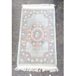 Chinese good quality blue ground rug with central floral medallion 93cm width x 155cm length.