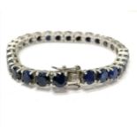 Silver blue stone set (tests as sapphires) bracelet - 17cm long & 23g total weight