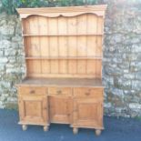 Pine two part dresser with antique base combprising of 3 cupords and 3 drawers. 132cm x 45cm x total