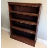 Antique oak shelf unit with scalloped leather shelf decoration and raised carved detailing to