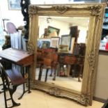 Large scale silver gilded ornate framed bevelled mirror - 160cm x 130cm.