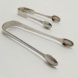 2 pairs of antique silver hallmarked sugar tongs 52g. In good used condition Georgian pair (13cm)