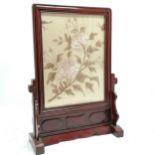Oriental 2 part carved wood table screen with silk embroidered panel. 58cm High, 41cm wide in