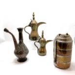 Collection of Syrian brass and copper jugs and a food carrier tallest 36cm high