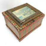 Antique paper covered box with sloping lid & picture frame detail to top depicting lighthouse & ship