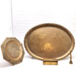 A Brass oval tray, 68 cm x 52 cm t/w embossed tray, Indian brass cigarette box and a bell.