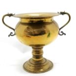 Antique Dutch brass vessel on a pedestal base with dolphin headed brass handles. 32cm high x 26cm