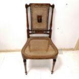 Sheraton revival satinwood Bergère and hand painted bedroom chair, with a cherub painted panel to