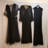 Three black evening dresses various era one with a significant tear
