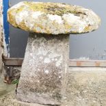 Carved stone saddle stone 50cm high x 55cm diameter