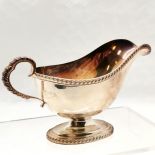 Mappin & Webb Ltd heavy gauge sterling silver sauce boat with gadrooned detail to border &