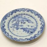 Antique blue and white plate 23cm diameter- has a chip and frittering to the rim, firing faults to