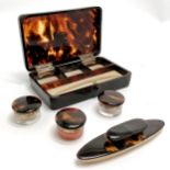 Antique tortoiseshell box containing tortoiseshell and silver topped jars and a nail buffer, box