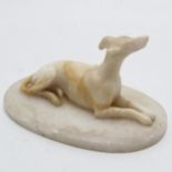 Antique hand carved alabaster study of a greyhound lying down - 15cm across x 8cm high ~ a/f with