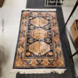 Good quality blue grounded wool rug 90cm x 150 cm - In good used condition